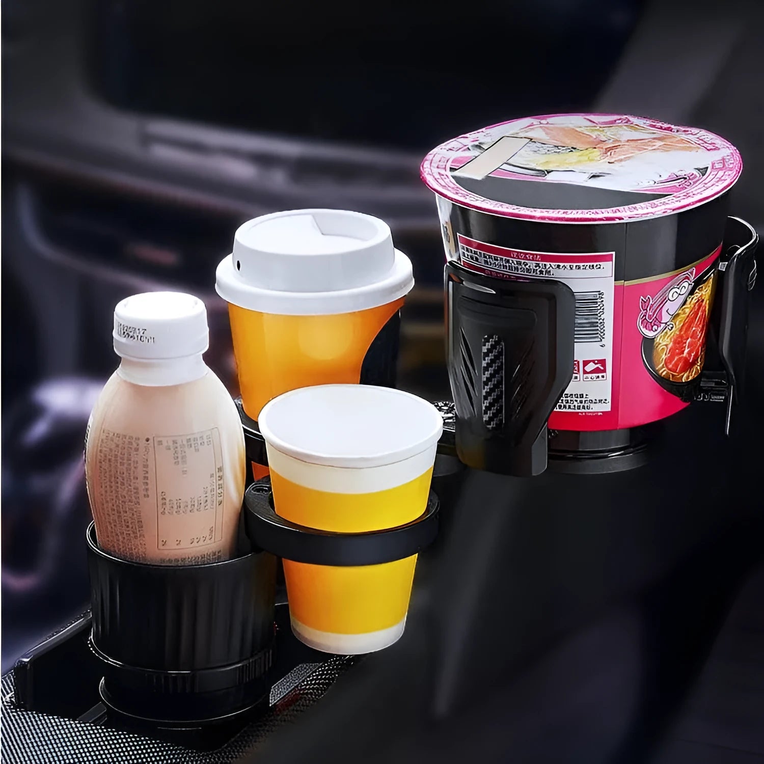Black car cup holder with retractable base and carbon fibre pattern, shown holding a water bottle.