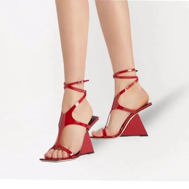 Women's black high heel sandals with a square toe and button fastening on a 9.5cm heel.
