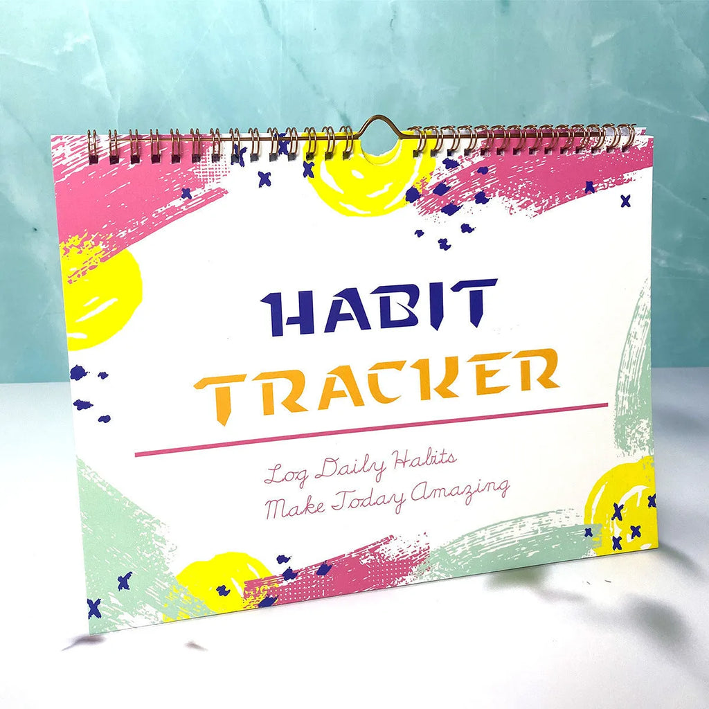 Habit tracking book with 12 pages measuring 21cm by 28cm in four colour options