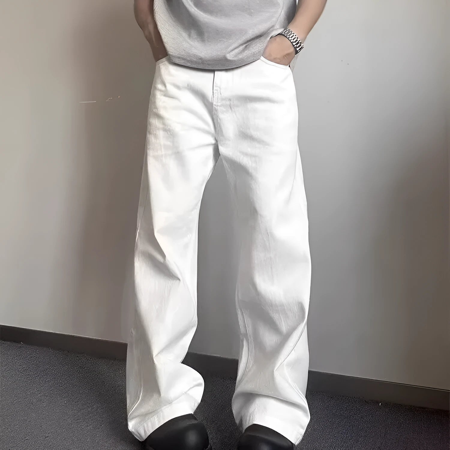 Men's white straight-leg denim jeans with wide leg opening and zip fly