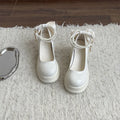 Women's black Mary Jane pumps with chunky heels and round toe on neutral background