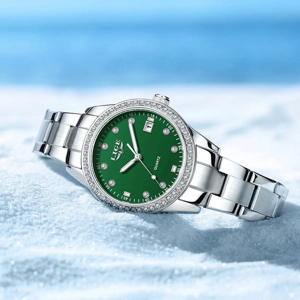 Silver stainless steel women's quartz watch with luminous hands on a 34mm round dial.