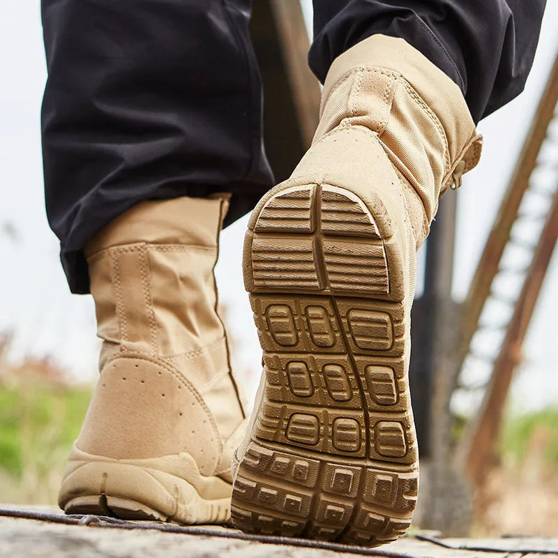 Black and sand coloured Yulong tactical desert combat boots for outdoor climbing and sports.