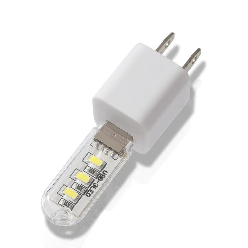 Small white USB LED night light showing warm and white light colour options