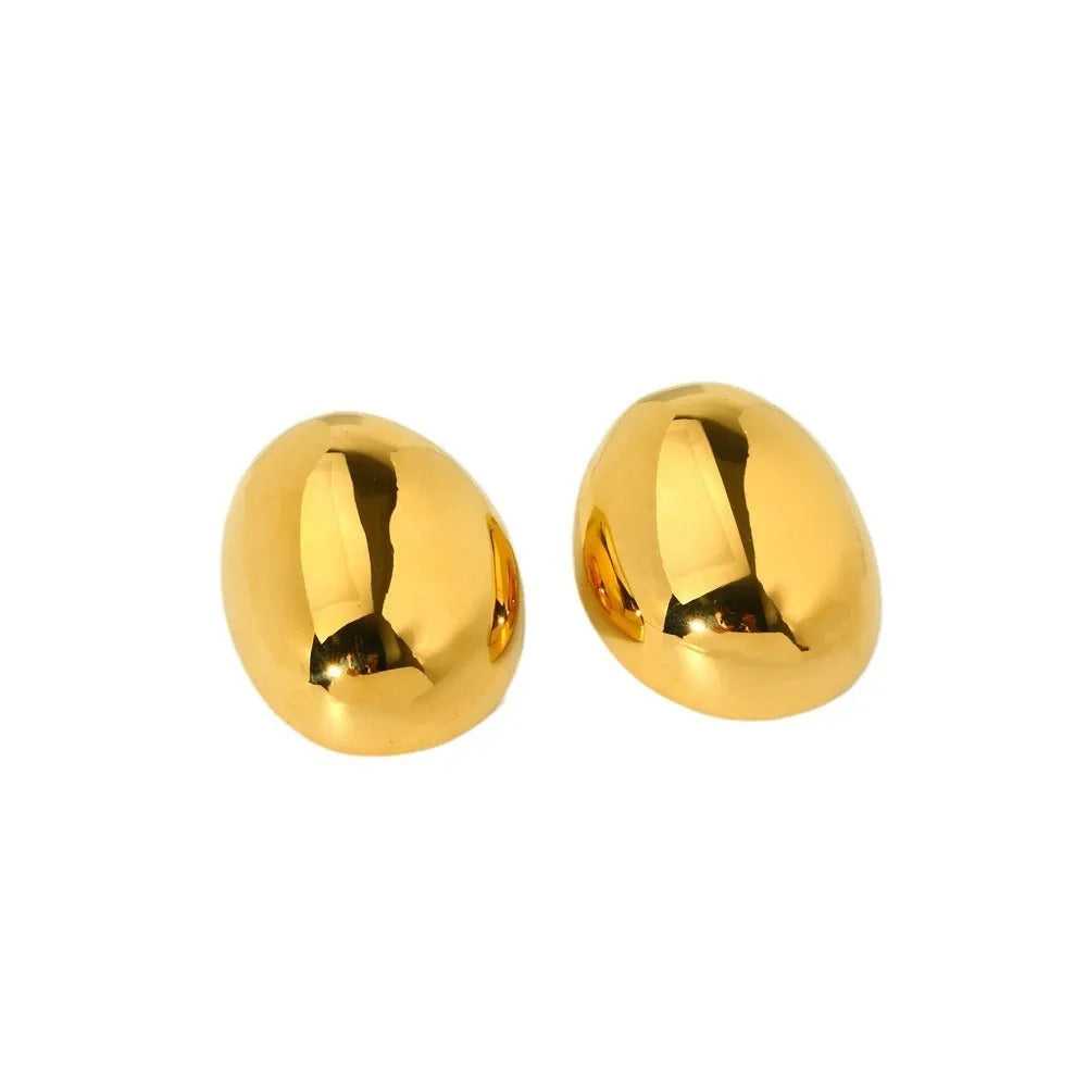 A pair of geometric line design ear studs with a high-shine glazed silver finish.