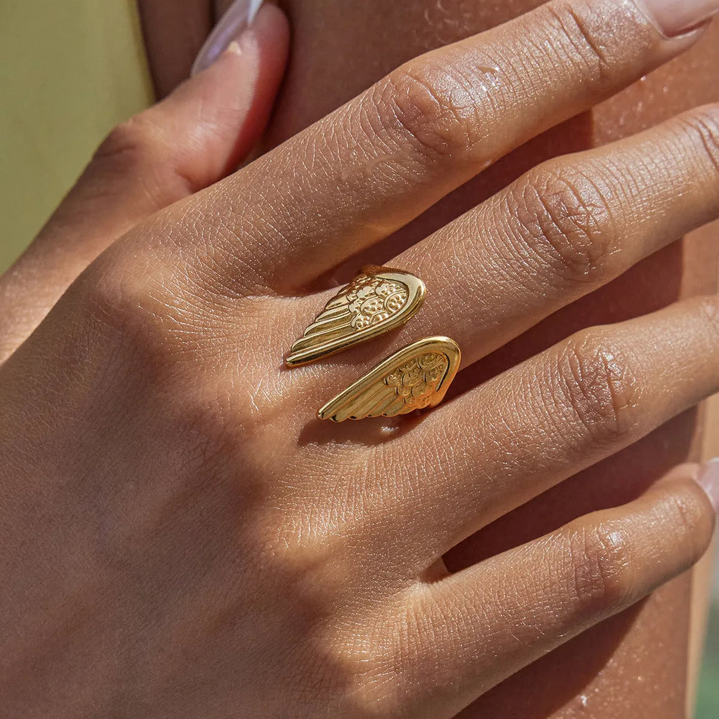 Silver wings opening ring with electroplated finish on stainless steel, adjustable jewellery design