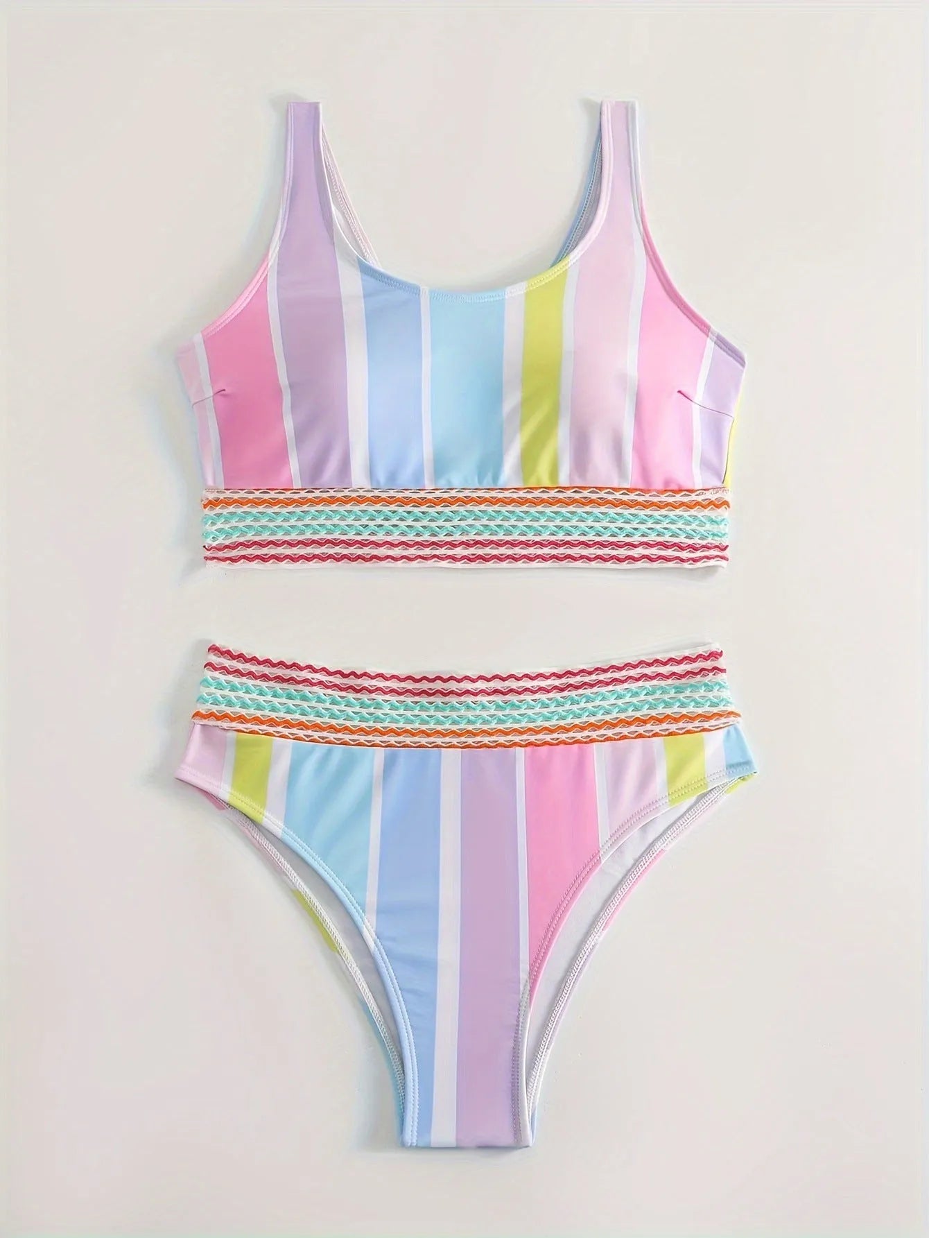Women's striped sport bikini top and briefs on a white background.