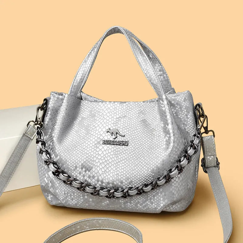 Genuine leather horizontal square shoulder bag with chain detail and snakeskin texture, multiple zippered compartments, available in various colours