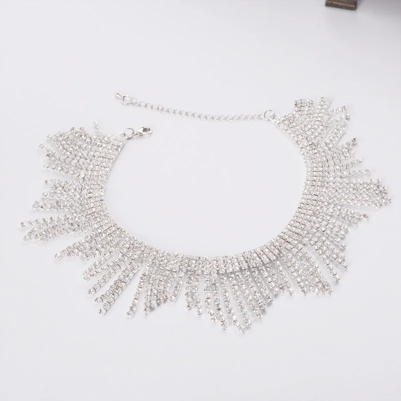 Alloy necklace with gold electroplated finish, geometric tassel pendant, diamond centre, box chain on white background