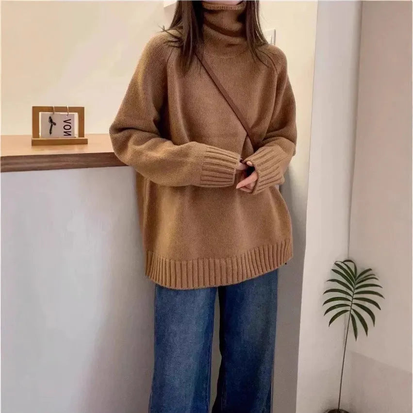 Women's loose turtleneck sweater with a thick curling pile collar in a solid colour