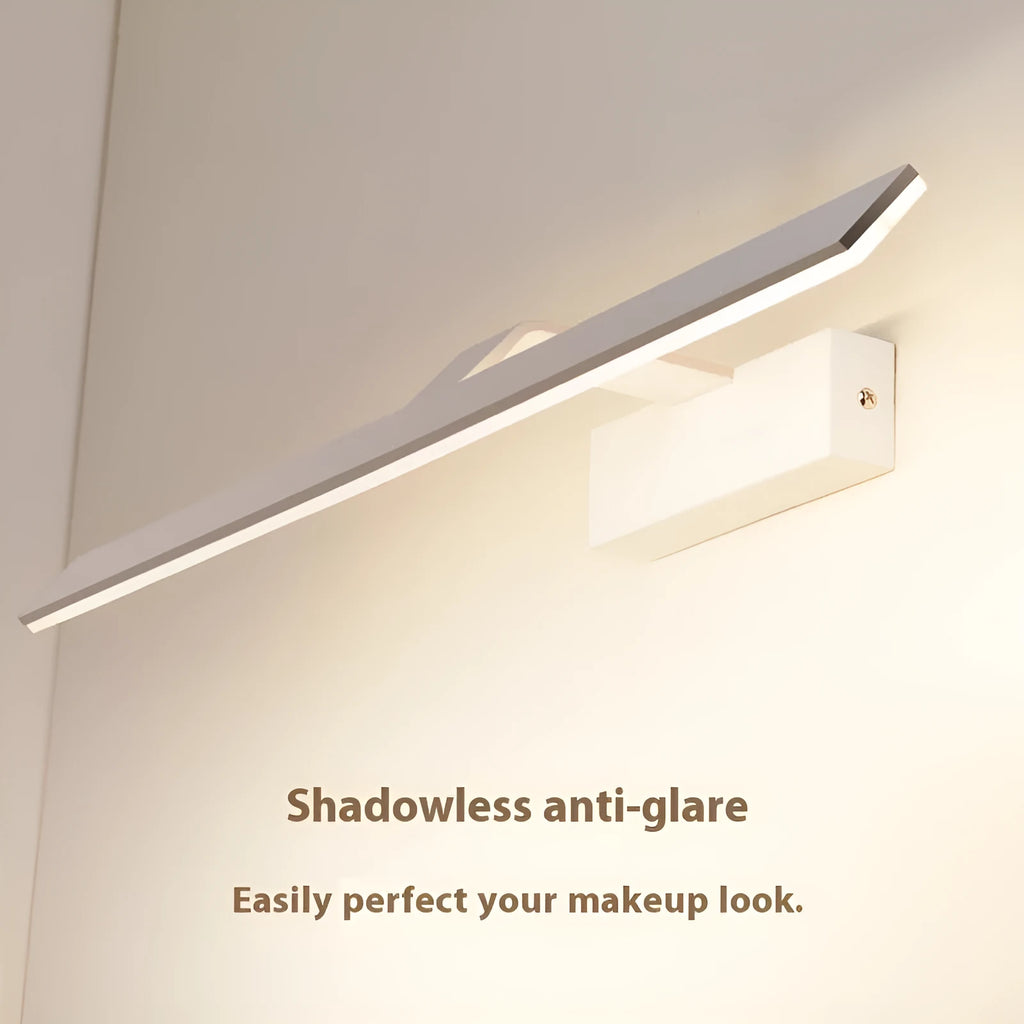 White framed LED illuminated bathroom mirror with integrated lighting mounted above bathroom basin