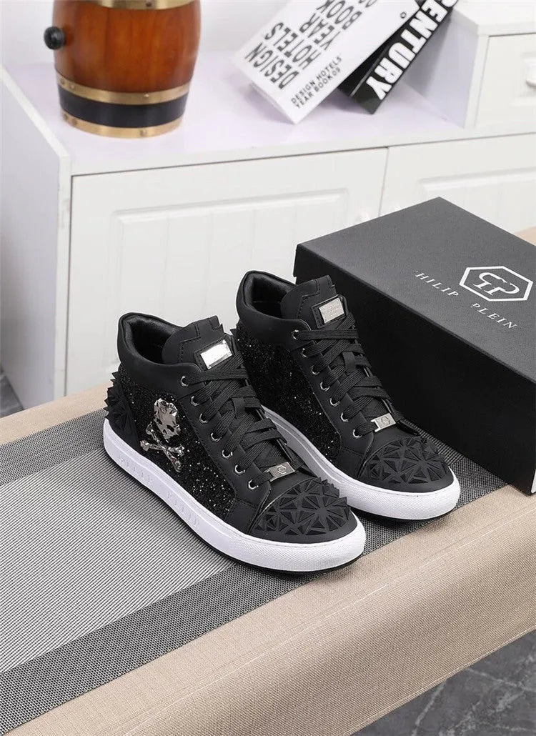 Men's black high top shoes with a skeleton design detail on the leather upper.
