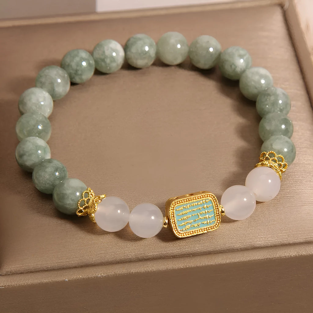 Women's oil green emerald crystal bracelet with five scriptural charms on wrist