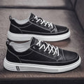 Men's white PU leather casual sneakers with a flat bottom and low heel on a plain background