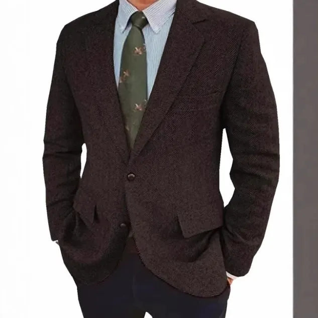Men's brown herringbone pattern retro suit jacket with long sleeves on a hanger.