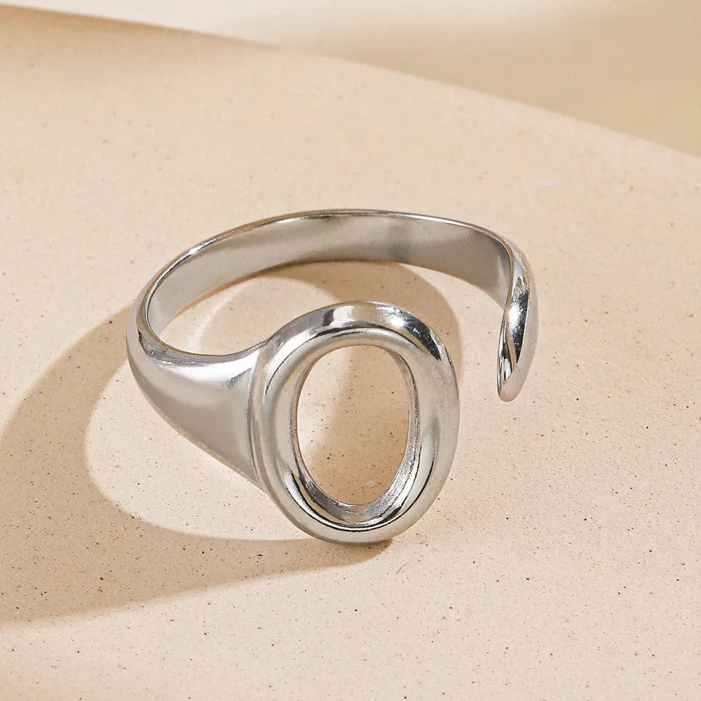 Oval ins style adjustable stainless steel ring in gold and steel colours on white background