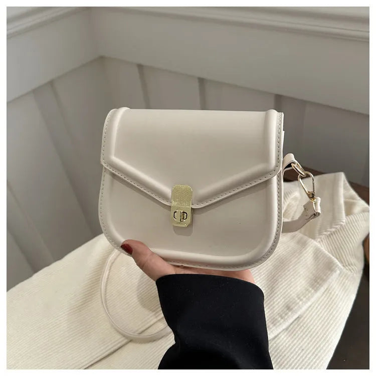 Soft PU leather messenger bag in clam shell design, shown in a horizontal square shape with a shoulder strap.