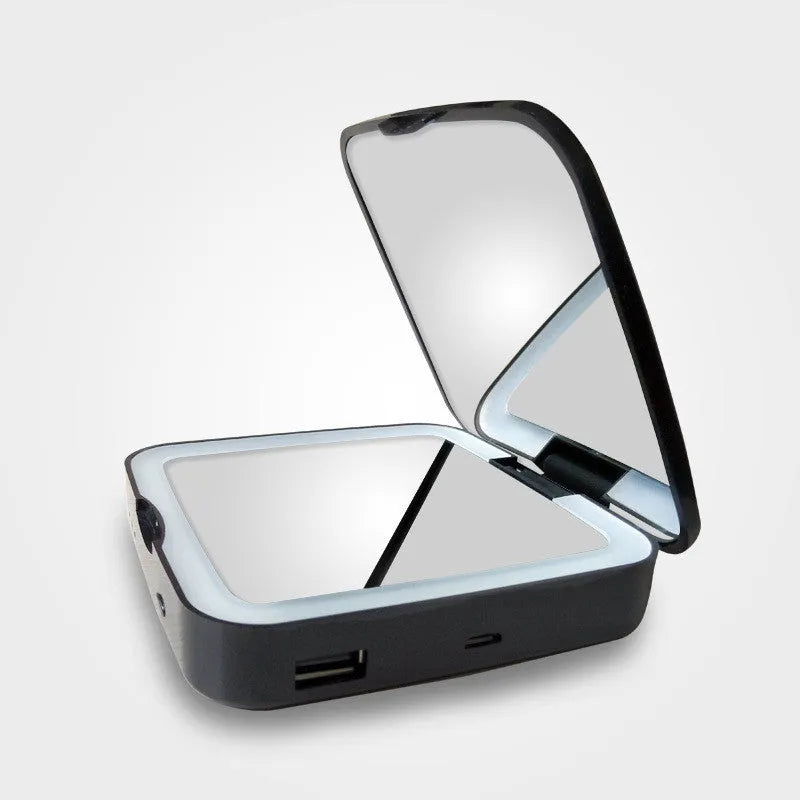 Two-sided makeup mirror with magnification and adjustable lighting in black or white
