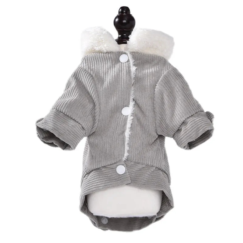 A grey lambswool fleece-lined vest for dogs on a hanger, showing its soft lining and size label.