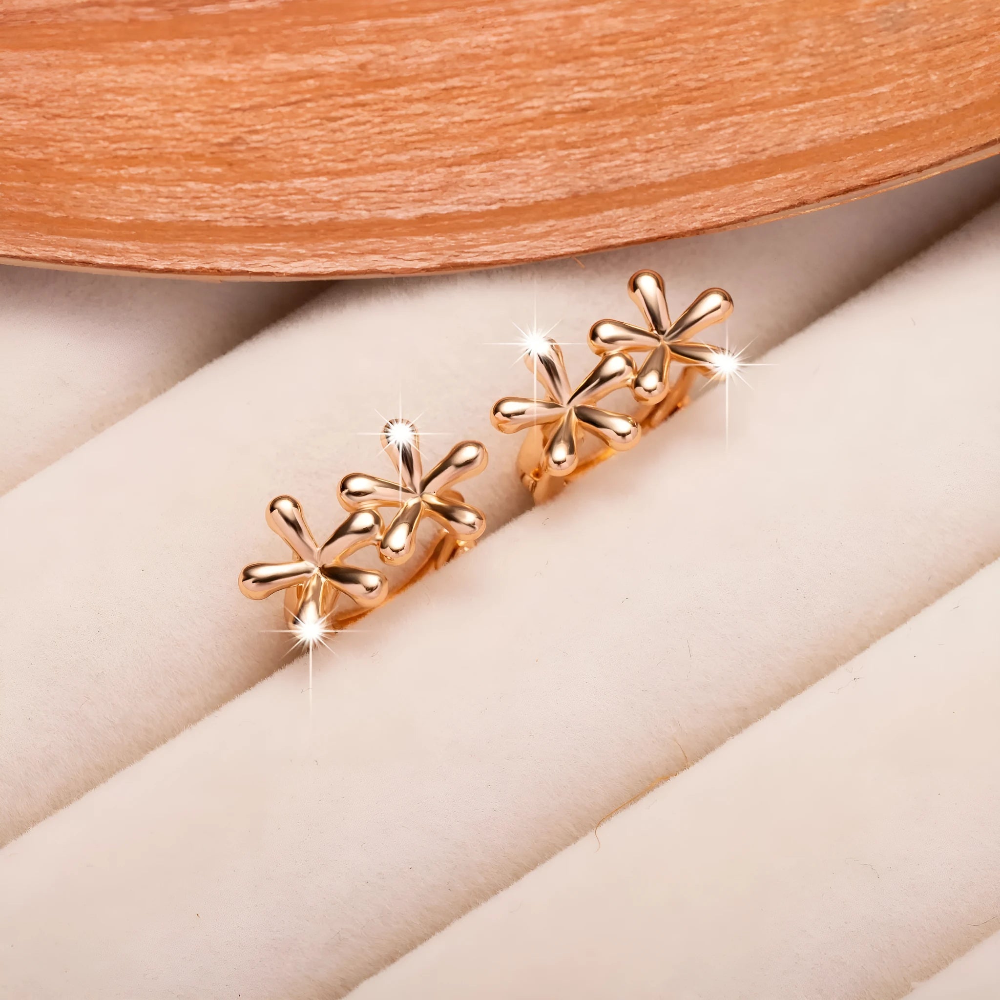 Rose gold electroplated waterdrop flower earrings with circular design and butterfly backs