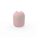 Round desktop humidifier in ivory white colour with USB cable and water tank showing 250ml capacity