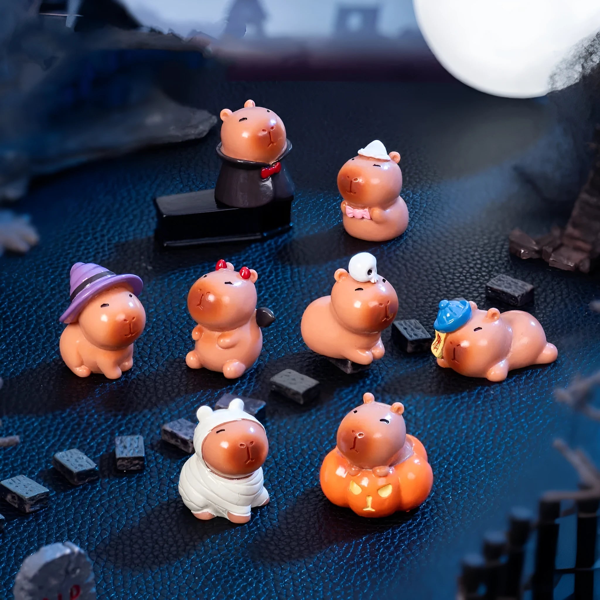 Halloween capybara resin figurine in one of eight designs like pumpkin or vampire.