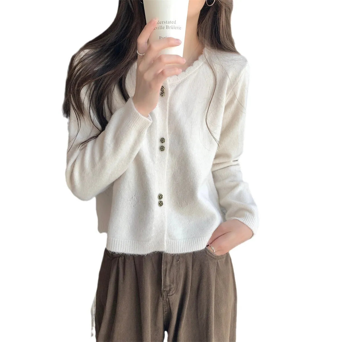 Women's long-sleeved acrylic cardigan coat in milky white, shown open in cardigan style