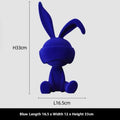 Small blue resin ornament of a rabbit wearing a blindfold on a wooden table.