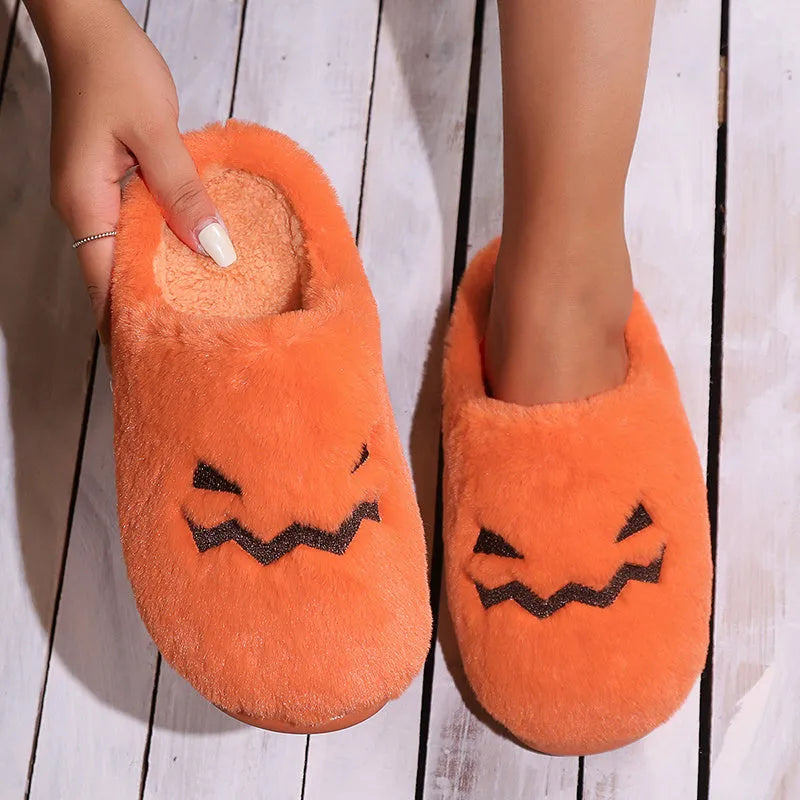 Orange Halloween pumpkin slippers with coral velvet upper and plush lining for indoor winter wear