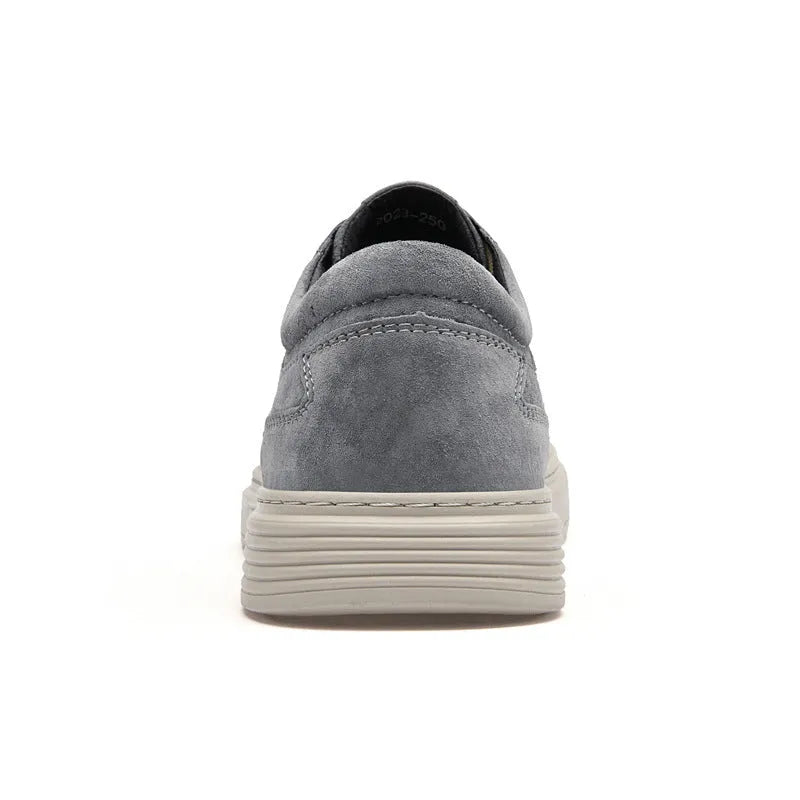 Men's grey casual skate shoes with pigskin leather upper and rubber sole, front lace-up closure