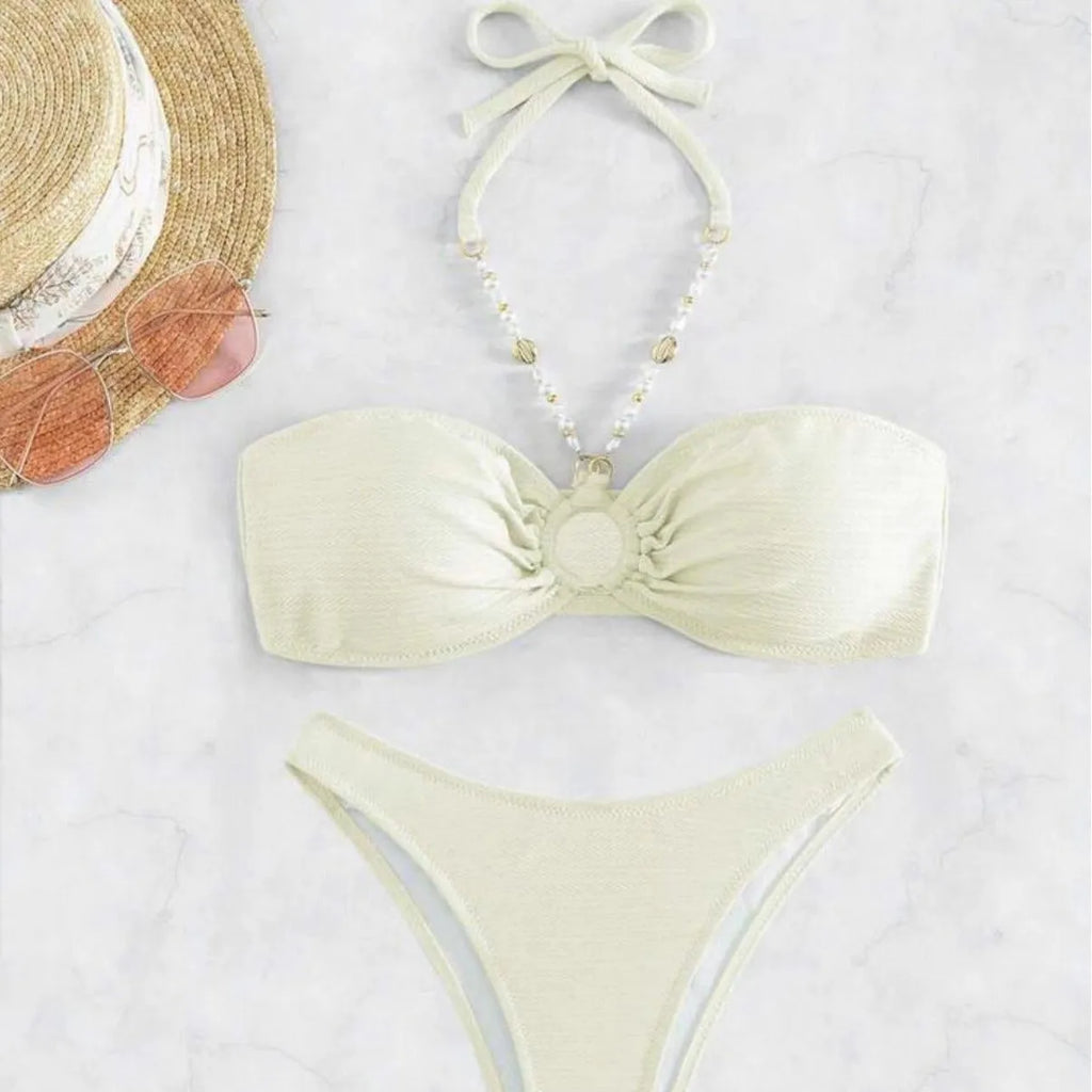 Women's solid colour halter bikini set in creamy-white, shown front-on.