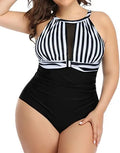 Women's black one-piece swimsuit with lace trim on a mannequin.