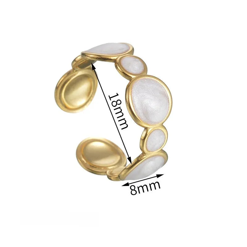 A geometric stainless steel ring with an adjustable opening and an electroplated finish.