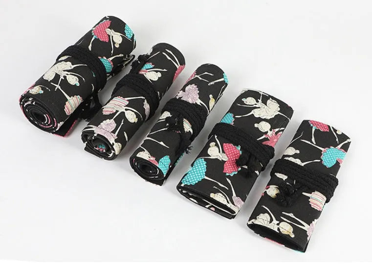 Square canvas rolling pencil case with ballet girl print, showing multiple pencil holes inside.