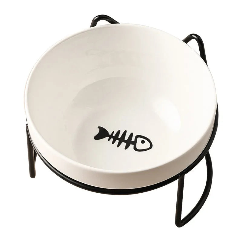 White ceramic cat bowl with paw print design in a black iron cat-ear frame.