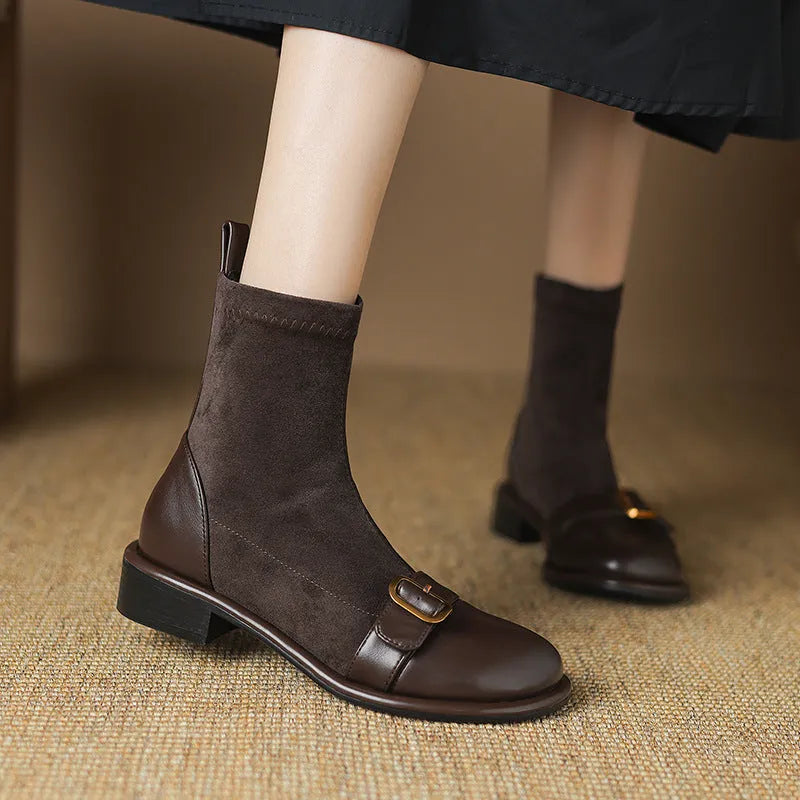Women's black low heel lace-up Martin boots with round toe and rubber sole.