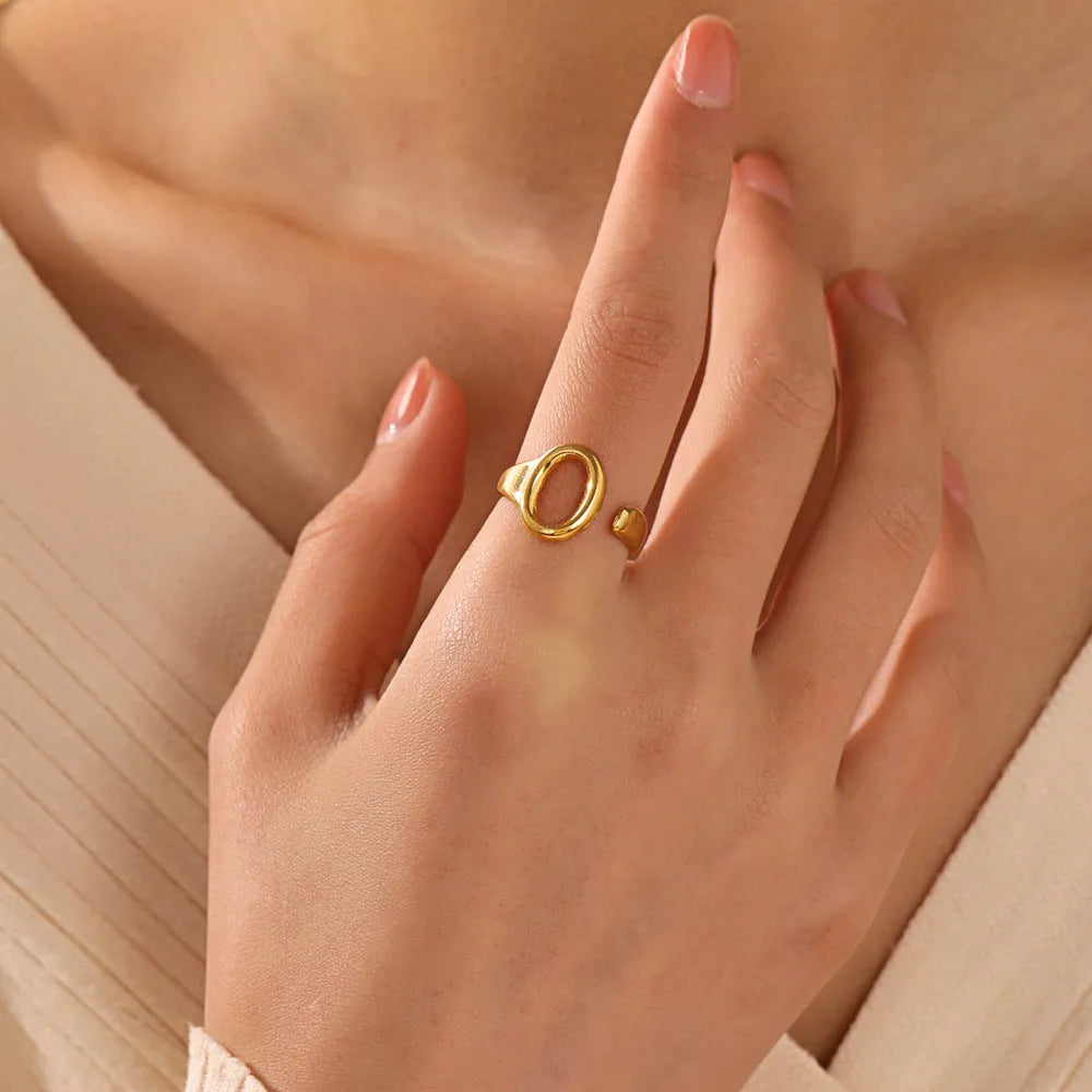 Oval ins style adjustable stainless steel ring in gold and steel colours on white background