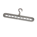 Nine-hole plastic folding pant hanger shown in beige, blue, gray, green, and pink colour options