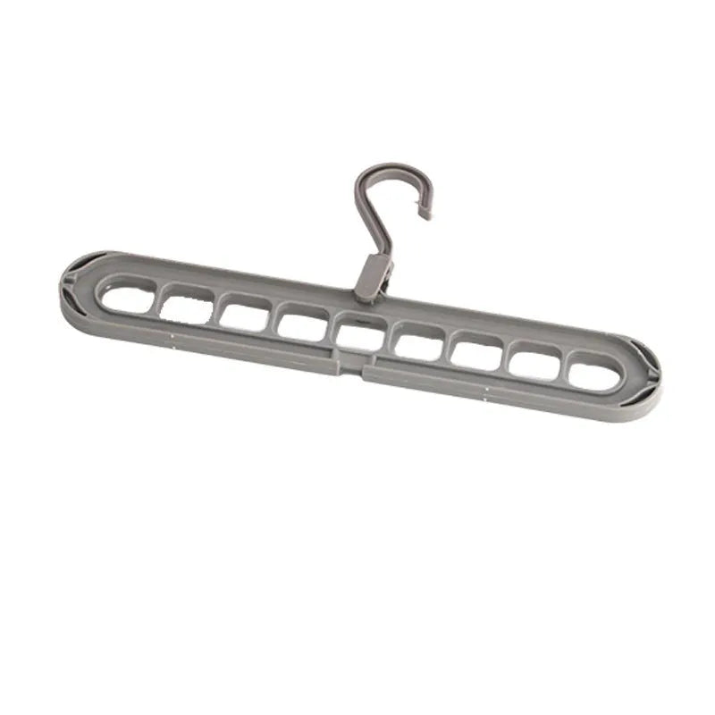 Nine-hole plastic folding pant hanger shown in beige, blue, gray, green, and pink colour options