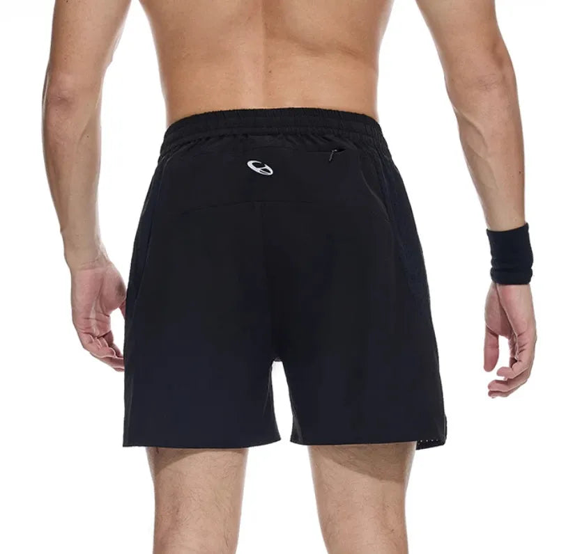 Black running shorts with laser-punched stitching and four-sided stretch fabric laid flat.