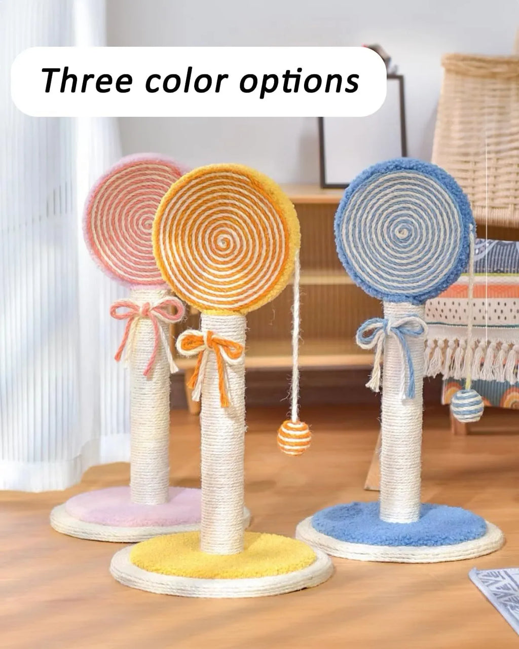 Blue cat scratching post made of natural sisal with a hanging ball on a stable white base.