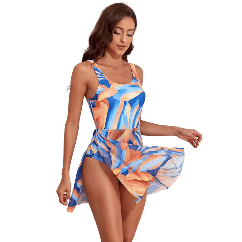 Women's single-shoulder one-piece swimsuit with floral digital print and slim waist.