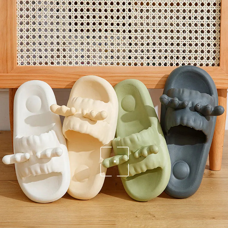 White deer horn pattern EVA flip-flop slippers with hollow-out design on a bathroom floor
