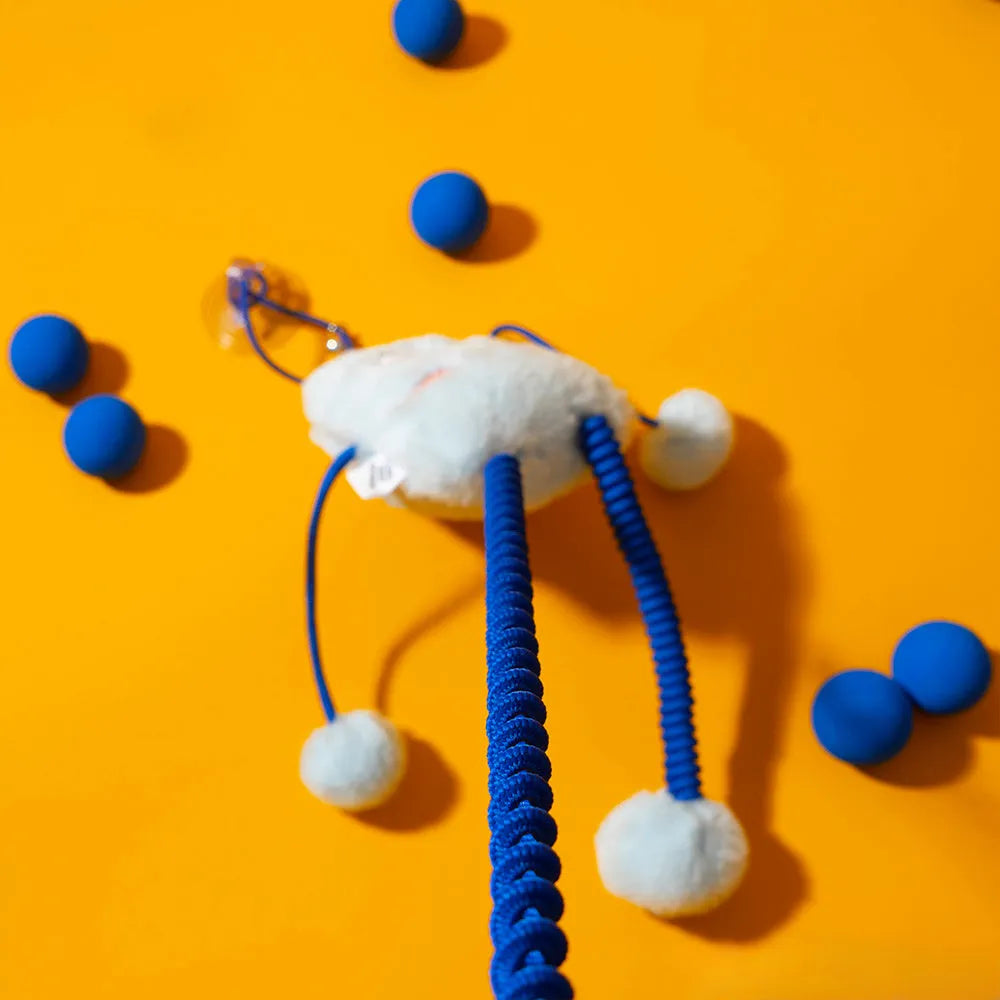 Blue plush ring cat toy with mint bell on an elastic rope