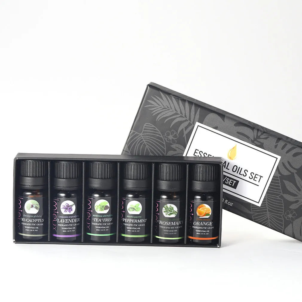 Six 10ml essential oil bottles in a row – tea tree, mint, sweet orange, eucalyptus, rosemary, lavender