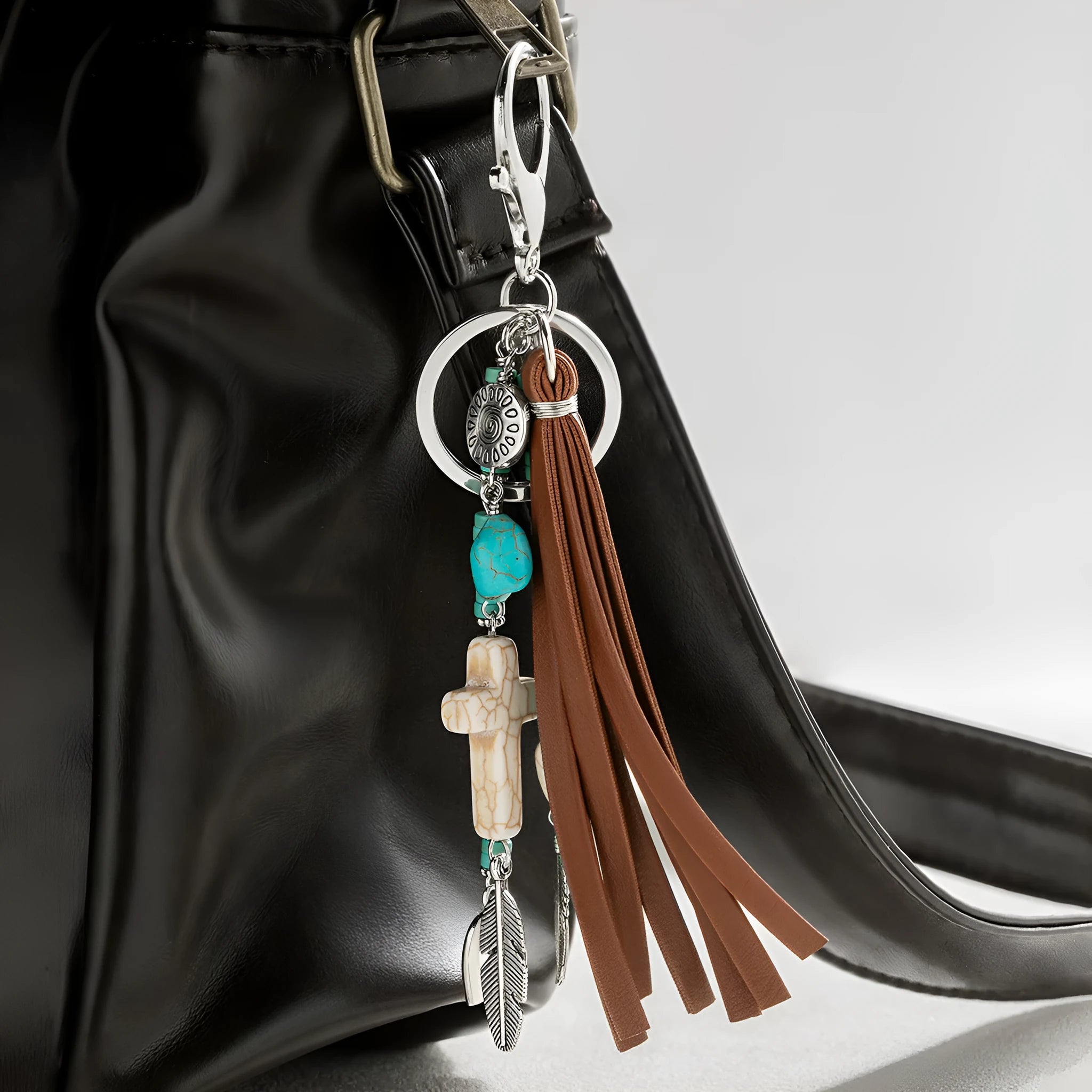 Cross alloy leather tassel pendant keychain in retro style, colour XY-3669, on a neutral background