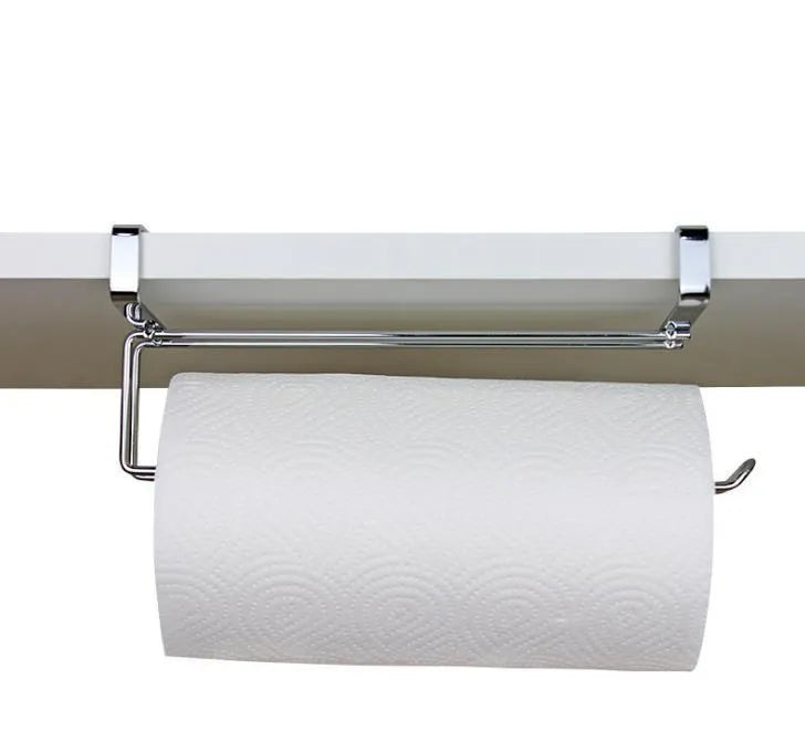 Silver stainless steel paper towel rack mounted on back of white cabinet door.