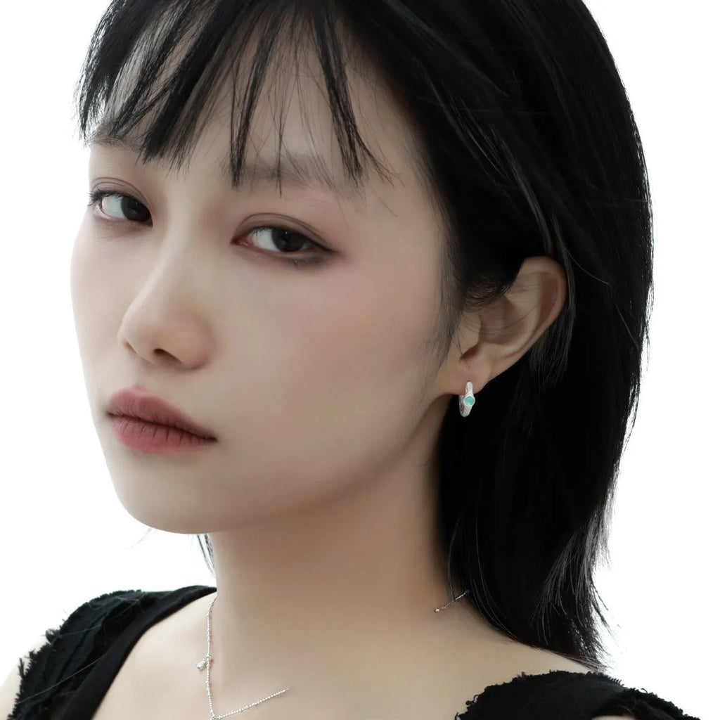 Geometric burnt silver women's ear clip made from 925 silver with circular design elements