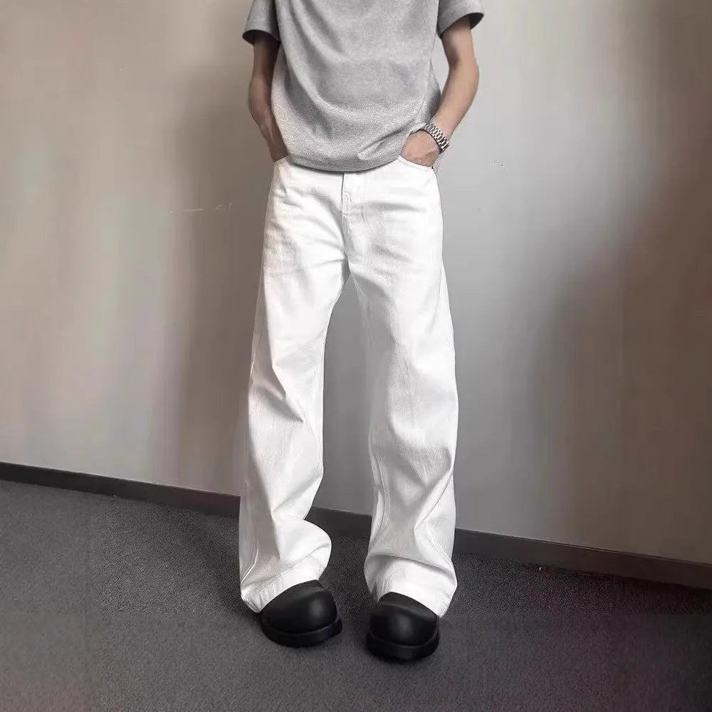 Men's white straight-leg denim jeans with wide leg opening and zip fly