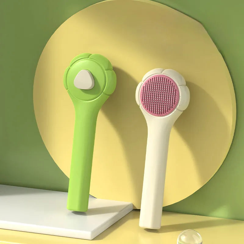 Floating needle comb for cats and dogs in green colour with ABS handle and steel teeth